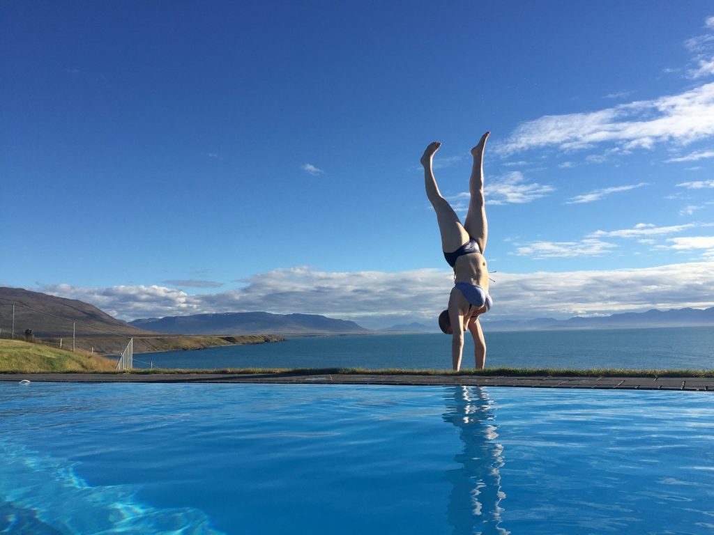 By the most beautiful swimming pool in Iceland. Handstand - My Yoga Anxiety